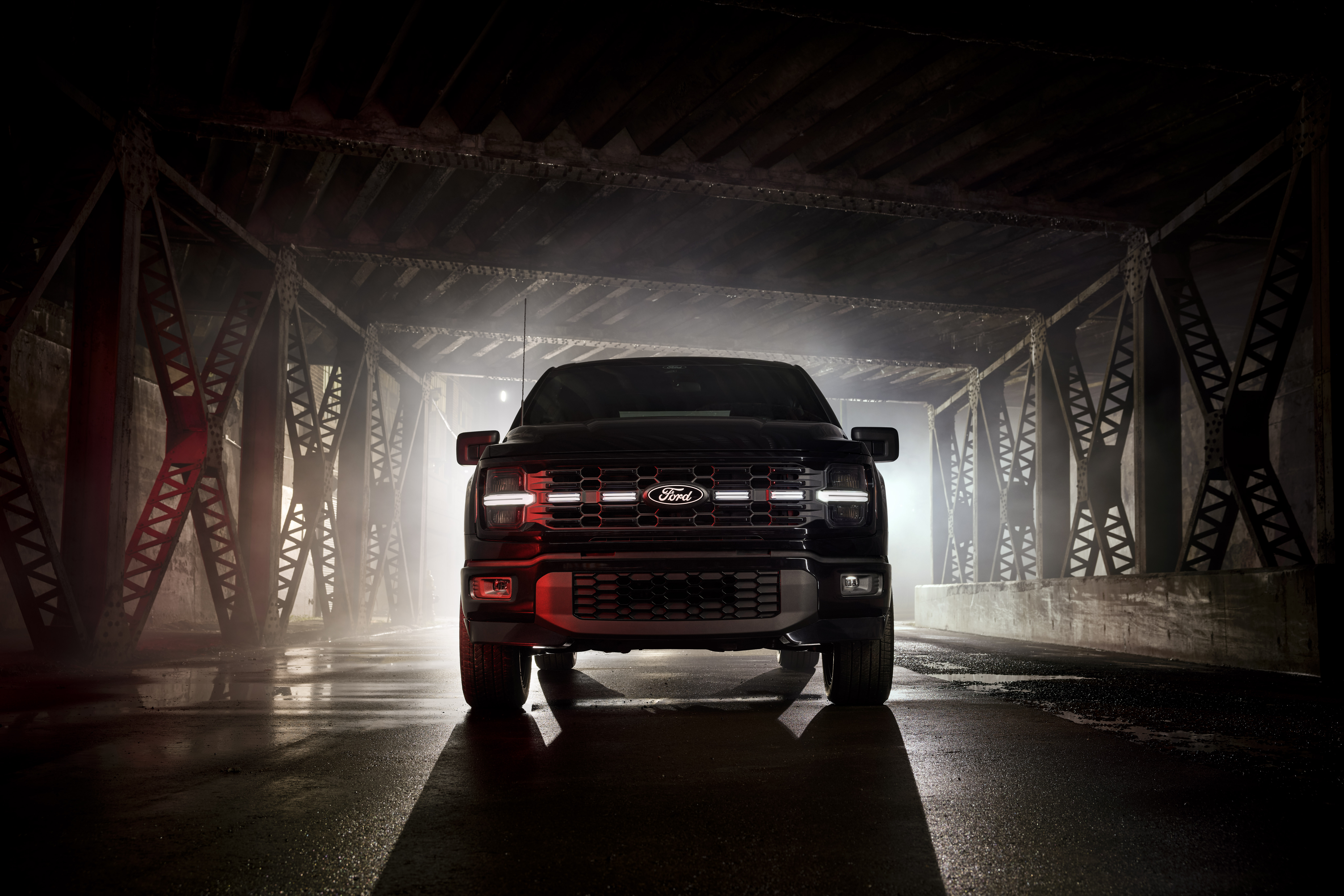 Front-end shot of illuminated grill of 2025 Ford F150 Lobo